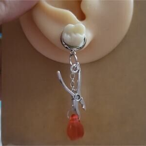 Creepy bloody tooth pliers earrings